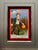 Framed antique Halloween postcard featuring vintage holiday imagery in a decorative frame.