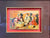 Framed antique Halloween postcard featuring vintage holiday imagery in a decorative frame.